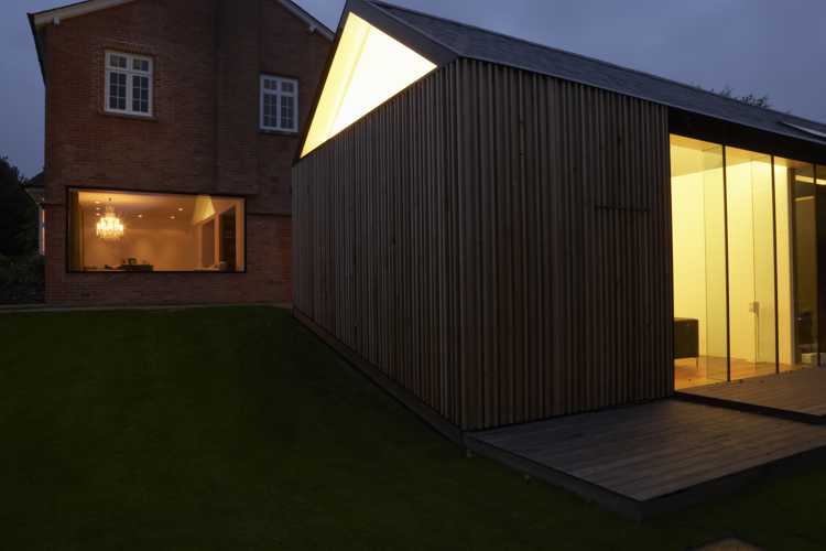 Modern rear home extension at night