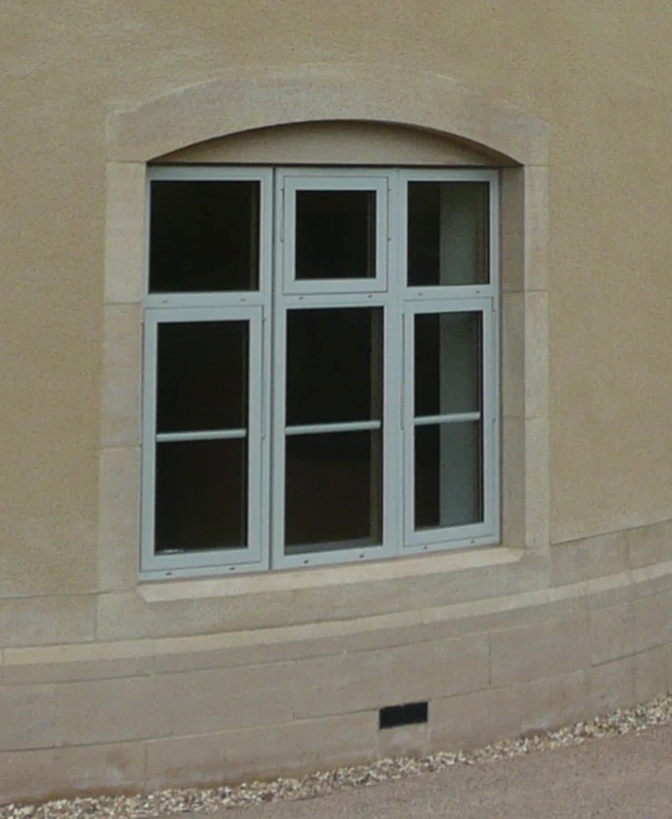 Photo of finished side window of stone entrance porch